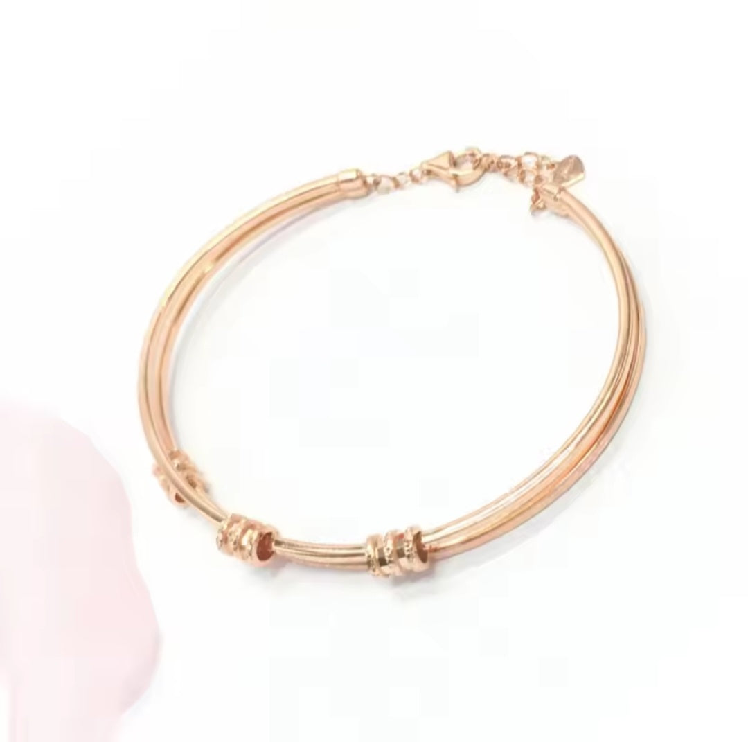 Rose Gold Geometric Bracelet with Purple Details – Elegant Women’s Jewelry