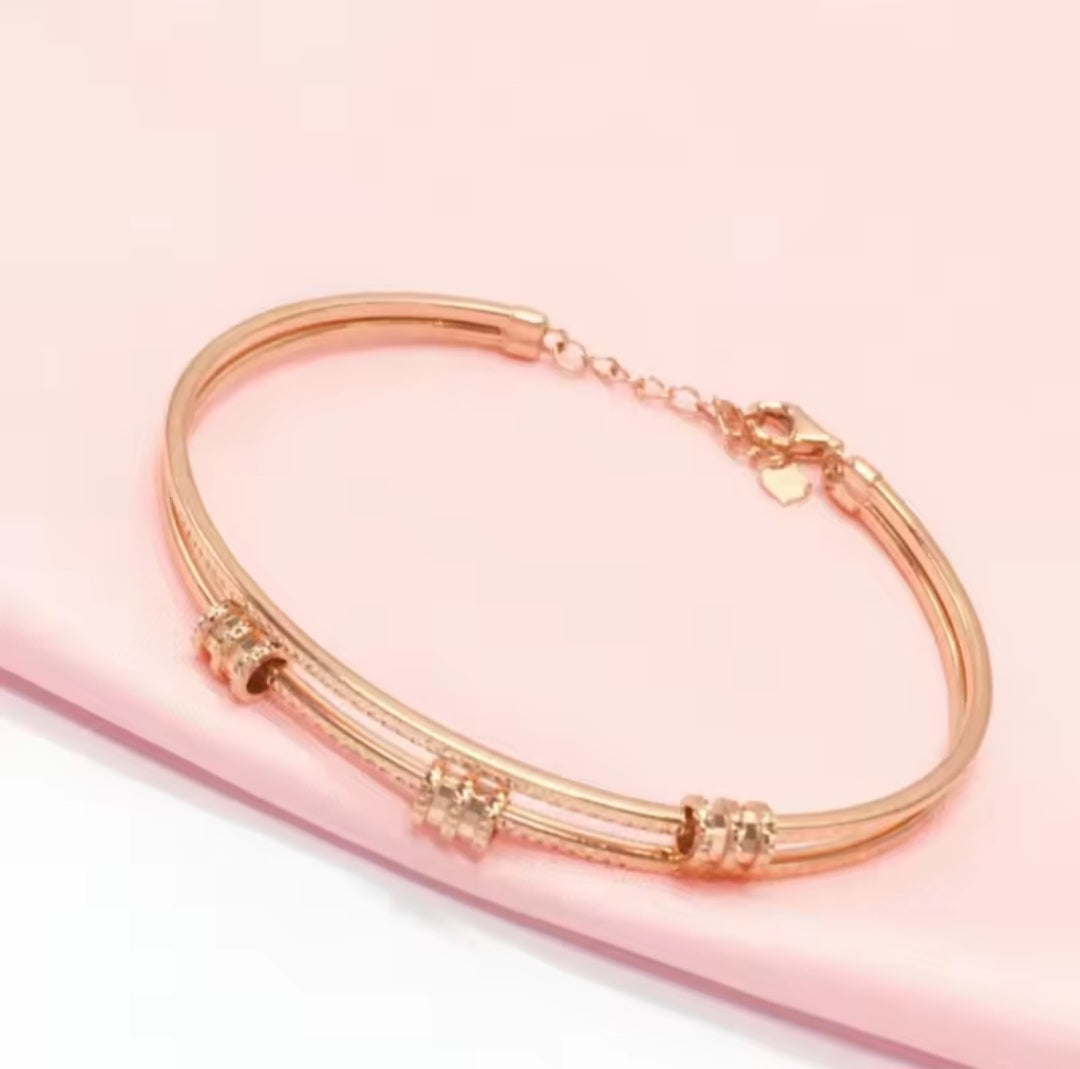 Rose Gold Geometric Bracelet with Purple Details – Elegant Women’s Jewelry